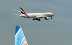 An Emirates Boeing 777-31H aircraft takes off from Dubai International Airport on April 6, 2020.