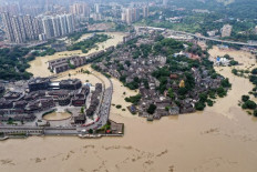 This aerial photo taken on August 19, 2020 shows a flooded area in China's southwestern Chongqing. - Floods in mountainous southwest China have washed away roads and forced tens of thousands from their homes, with authorities warning on August 19 the giant Three Gorges Dam was facing the largest flood peak in its history.
