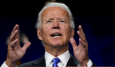 Vowing to turn page on Trump era, Biden promises 'light' over 'darkness'