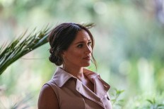 In this file photo taken on October 02, 2019 Meghan, the Duchess of Sussex arrives at the British High Commissioner residency where she will meet with Graca Machel, widow of former South African president Nelson Mandela, in Johannesburg. 