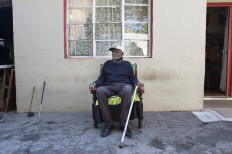 Fredie Blom poses for a portrait while celebrating his 116th birthday at his home in Delft, near Cape Town, on May 8, 2020. Blom died aged 116, his family said on Aug. 22, 2020. 