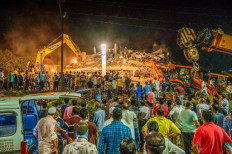 One dead, scores feared trapped in India building collapse