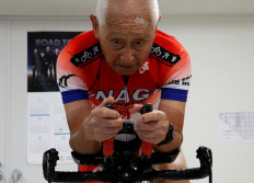 Hiromu Inada 87, record holder of the oldest person to complete an Ironman World Championship, works out on his bike at his training facility in Chiba, near Tokyo, Japan August 26, 2020. Picture taken August 26, 2020.  