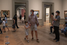 Visitors tour the Metropolitan Museum of Art in New York as it reopens to the public on August 29, 2020. 