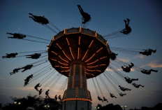 Visitors enjoy an attraction, amid the coronavirus disease (COVID-19) outbreak, at Toshimaen amusement park which will close 94 years after it first opened with part of the site to be turned into a new Harry Potter theme park in 2023, in Tokyo, Japan, on August 9, 2020. 