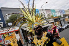 Lone revelers brighten Notting Hill's empty streets on carnival day