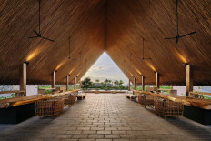 The lobby of the Sheraton Belitung Resort features burnt granite rocks as flooring and local Lenggadai wood for the ceiling.