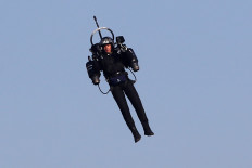 In this file photo taken on April 21, 2018 'Jetpack Man' flies during the 2018 Red Bull Air Race World Championships in Cannes. 