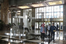 Employees walk through the lobby of Bank Indonesia (BI), located on Jl. Thamrin in Central Jakarta, on Feb. 26, 2020.