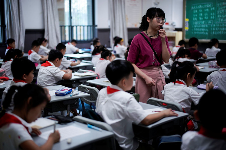 Students are pictured during a Chinese class at Changchun Street Primary School of Wuhan during a government-organized media tour following the coronavirus disease (COVID-19) outbreak, in Wuhan, Hubei province, China, September 4, 2020. 