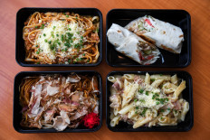 Usual onboard meals are pictured at a Thai Airways pop-up airplane-themed restaurant at the airlines headquarters while their fleet is still grounded at the airport and the company awaits a bankruptcy court decision, in Bangkok, Thailand, on September 3, 2020. 