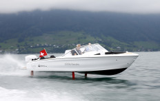Christian Vogel, manager of W.A.R. Bootbau und Boothandel AG steers an electric powered Candela Seven boat on Lake Lucerne near Lucerne, Switzerland, on September 2, 2020. 