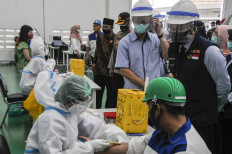 Factory workers in Bekasi required to report daily activities to stem COVID-19 risk