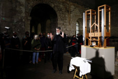 Professor Rainer O. Neugebauer speaks as visitors enter the Church ahead of a performance of John Cage's work 'As Slow As Possible' with the first note change in seven years, in Halberstadt, Germany, on September 5, 2020. 