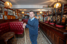 Publican Joe Sheridan poses for a photograph in his closed pub, Walsh's bar, in the rural village of Dunmore, west of Ireland, on September 3, 2020. 
