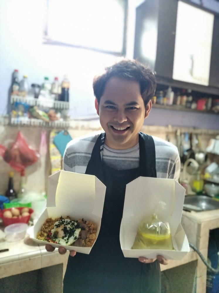 Family recipes: Shandy Gasella shows the main dishes of his family's online food business: fried rice with wagyu beef (left) and the Cirebonese 'empal gentong' (curry beef stew). Shandy and his wife Dewina expanded the menu of the restaurant belonging to his mother-in-law Uun Unasih when the COVID-19 pandemic hit the country in March.