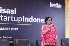 Going digital: The Tourism and Creative Economy Ministry's director of financial access, Hanifah Makarim, talks at an event to encourage small- and middle-sized businesses in the culinary industry to join the incubation program Food Startup Indonesia.