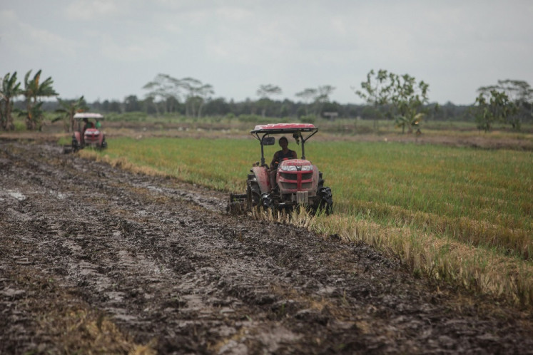 Field work: Farmers use tractors to plow rice fields in Belanti village in the Central Kalimantan regency of Pujang Pisau, which the government has designed as a food estate, on Sept. 4. 