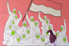 Wear your mask even if it's uncomfortable, Anies says