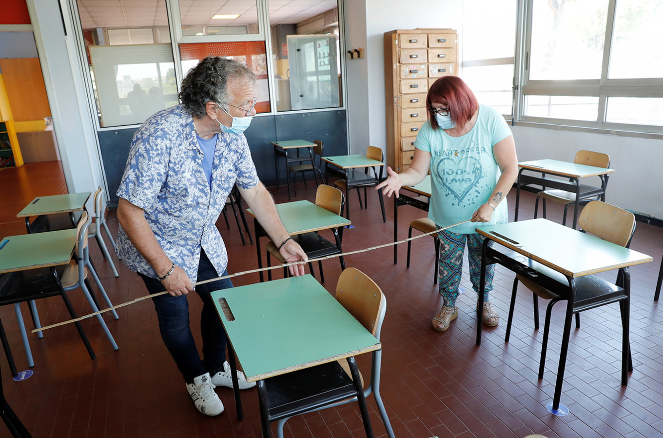Preparations are made at the Simonetta Salacone primary and secondary school ahead of reopening on Sept. 14 for the first time since the COVID-19 outbreak, with new protocols in place to avoid contagion, in Rome, Italy, on Wednesday.
