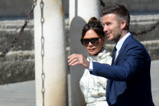 Former Real Madrid midfielder David Beckham and his wife Victoria Beckham arrive at the Cathedral of Seville on June 15, 2019 to attend the wedding ceremony of Real Madrid's Spanish football player Sergio Ramos and Pilar Rubio.

