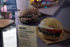 A poster showing product from plant-based burger maker Impossible foods been using at Starbucks, in Hong Kong, China, on September 9, 2020. 