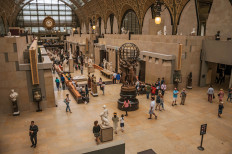 People and art at the main hall of the Quai d'Orsay Museum in Paris on July 11, 2017. 