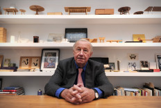 In this file photo taken on November 15, 2011 British designer Terence Conran poses for photographers during the opening of his exhibition 'Terence Conran: The Way We Live Now' at the Design Museum in London. 