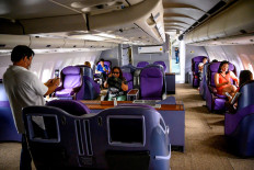 This photograph taken on September 1, 2020 shows visitors enjoying business class seats in a retired Airbus 330 air-plane turned into a coffee shop at an attraction site, outside Pattaya in Chonburi province. 