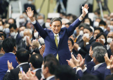 Japan ruling party head Suga preparing cabinet, continuity in foreground