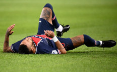 Paris Saint-Germain's Brazilian forward Neymar lies on the field during the French L1 football match between Paris Saint-Germain (PSG) and Marseille (OM) at the Parc de Princes stadium in Paris on September 13, 2020. 