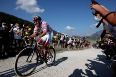 Team UAE Emirates rider Slovenia's Tadej Pogacar wearing the best climber's polka dot jersey rides on the Glieres plateau during the 18th stage of the 107th edition of the Tour de France cycling race, 168 km between Meribel and La Roche sur Foron, on September 17, 2020. 