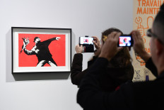 Banksy loses trademark case over the 'Flower Thrower'