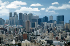 The skyline of skyscrapers in the Shinjuku shopping and business district is pictured in Tokyo on July 26, 2020.
