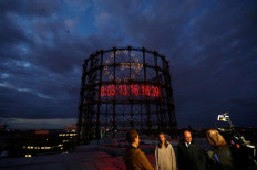 A giant 'carbon clock', installed by young activists from the 'Fridays for Future' campaign, displays how much carbon dioxide can be released into the atmosphere to limit global warming to a maximum of 1.5 or 2 degrees Celsius, at former gasometer in Berlin, Germany, on September 18, 2019. 