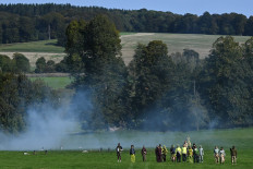 Models present creations from London-based designer Paria Farzaneh during a presentation for her Spring/Summer 2021 collection, during London Fashion Week in Amersham, north-west of London, on September 20, 2020.
