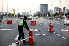 Israel tightens COVID lockdown as infections climb