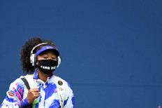 Naomi Osaka of Japan walks onto the court wearing a mask with the name of Tamir Rice prior to her match against Victoria Azarenka of Belarus (not pictured) in the women's singles final on day thirteen of the 2020 US Open tennis tournament at USTA Billie Jean King National Tennis Center. 
