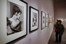 People visit the exhibition 'Man Ray and fashion' at the Musee du Luxembourg in Paris, on September 23, 2020.