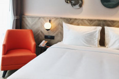 Room interior at Harris Suites Puri Mansion in West Jakarta.