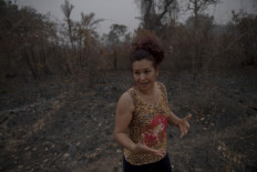 Pantanal Lodge manager Domingas Ribeiro, 46, shows burnt vegetation near Pantanal Lodge Hotel at Pantanal's wetlands, near the Transpantaneira park road in Mato Grosso state, Brazil, on September 19, 2020. 
