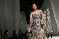 US model Ashley Graham presents a creation by Fendi's Spring/Summer 2021 women's and mens collection during the Milan Fashion Week, on September 23, 2020.