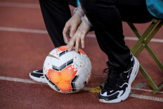 Out at last! Chinese football teams exit 70-day virus 'bubble'