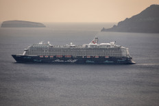 Aerial close up view of the German cruise ship TUI Mein Schiff 6 sailing within the Santorini Caldera on Sept. 18, 2020.