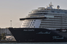 Maltese-flagged Mein Schiff 6, operated by German travel giant TUI is docked at the port of Piraeus early on September 29, 2020 after a dozen crew members were reported positive for the virus, state news agency ANA said. 