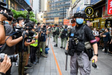 China jails 10 Hong Kong democracy activists for up to three years