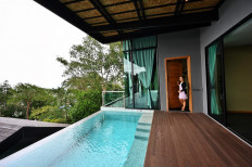 This photo taken on Saturday shows a villa that has been converted for use as an alternative state quarantine (ASQ) room for incoming overseas tourists at The Senses Resort on Patong beach in Phuket. A private infinity pool, gourmet meals... and round-the-clock surveillance from a 
