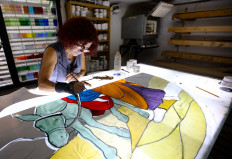 Lebanese stained glass artist Maya Husseini, 60, works on a piece for a cathedral under construction in Jordan, her main project before the Beirut port blast, in her basement workshop on the outskirts of the capital Beirut, on September 18, 2020. 