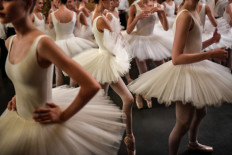 In this file photo taken on September 27, 2018, dancers get ready prior to the opening of the annual gala at the Opera Garnier in Paris.