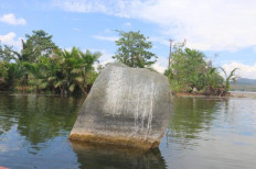 A megalithic era stone relic located in Lake Sentani, Jayapura regency, Papua.